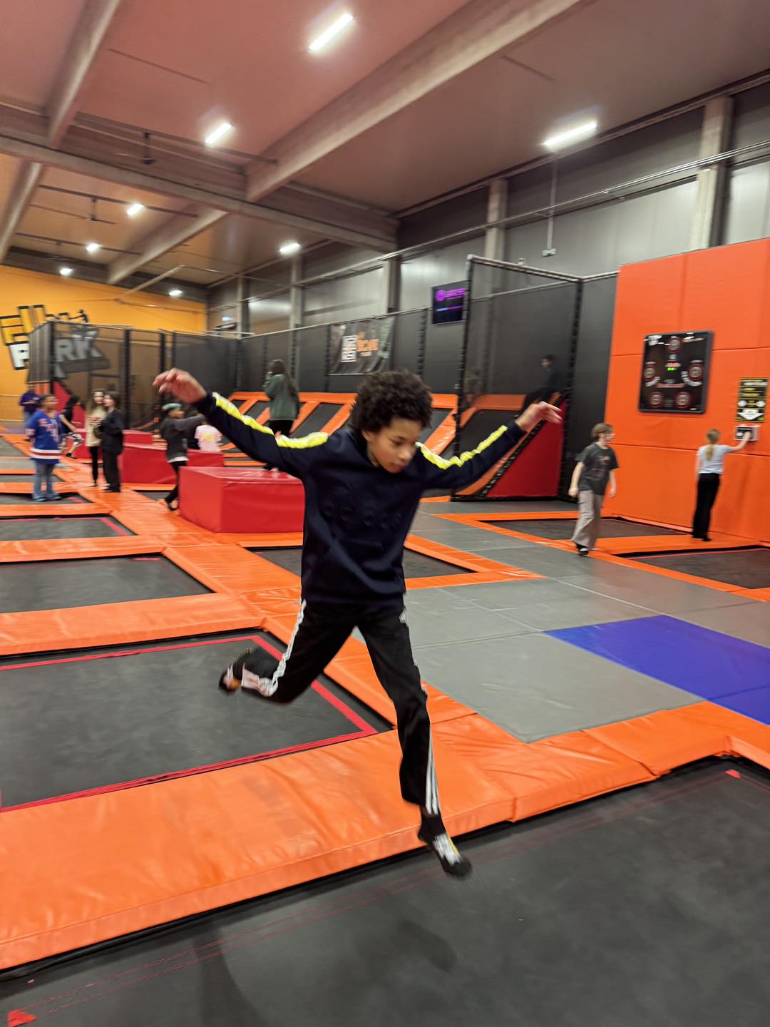 5th grade student jumping at Fun Park trampoline park.